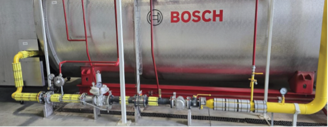 Magnatech magnetic conditioning units installed on the gas fuel line feeding a Bosch industrial boiler