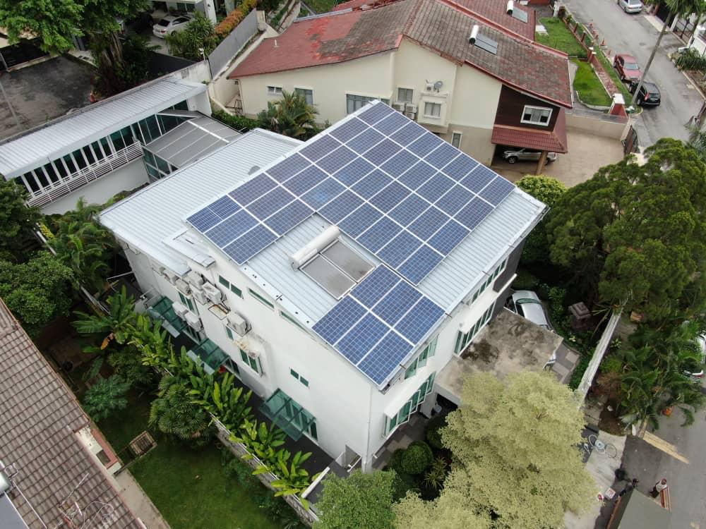 Rooftop solar array on a bungalow in Bukit Damansara, aerial view